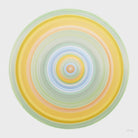 Nature-inspired circular artwork in green yellow and blue symbolising earth sun and water.