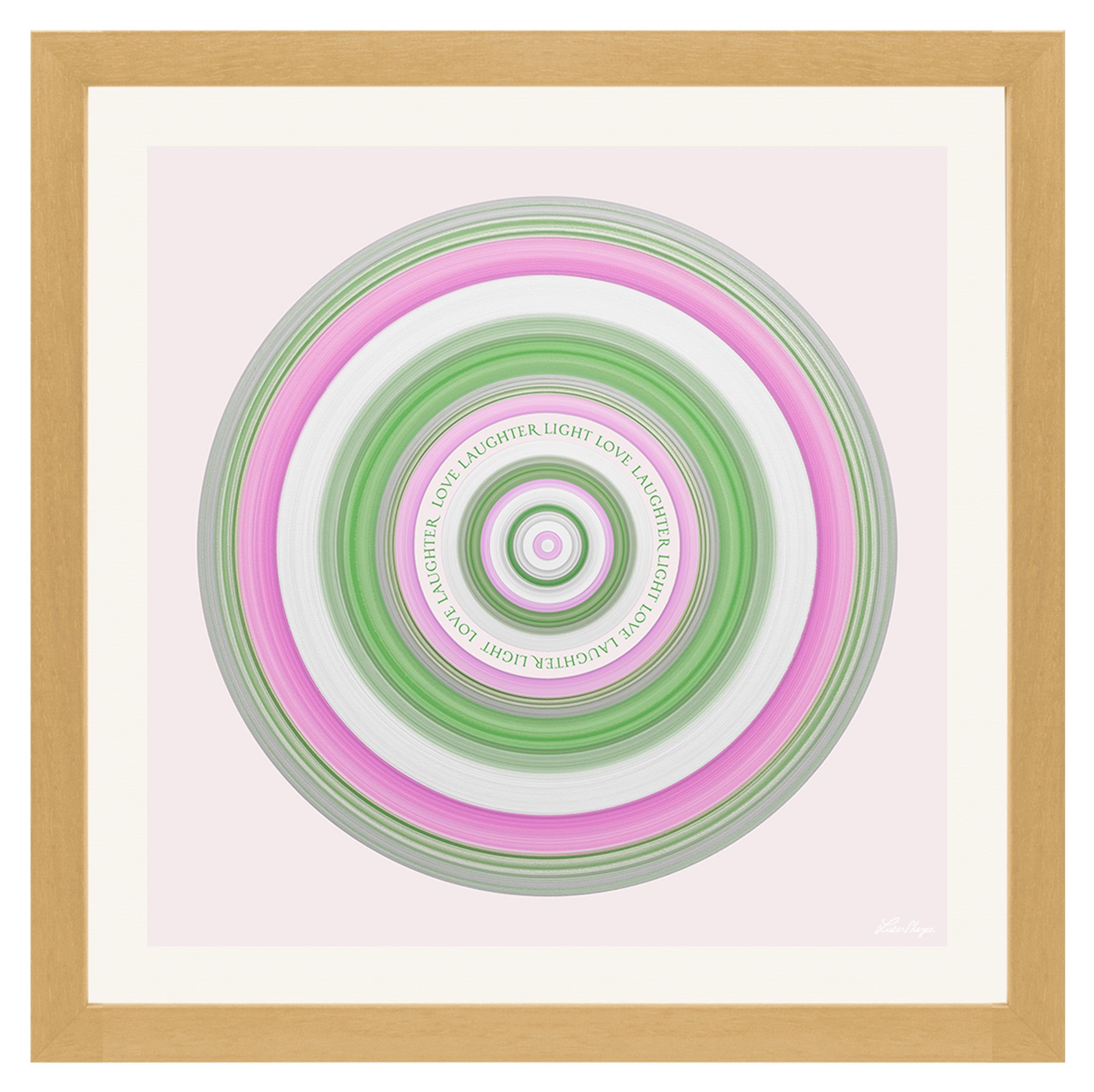 Framed artwork with concentric circular design in green, pink, and white on a light background